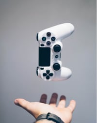 Image of game controller with hand