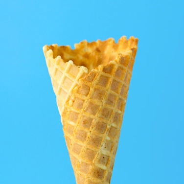 Empty ice cream cone on blue BG